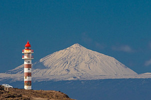 Snowcapped Teide and the lighthouse of Sardina de Gáldar
