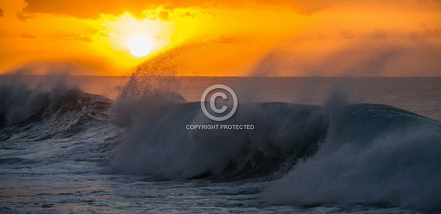 Sunset over wave